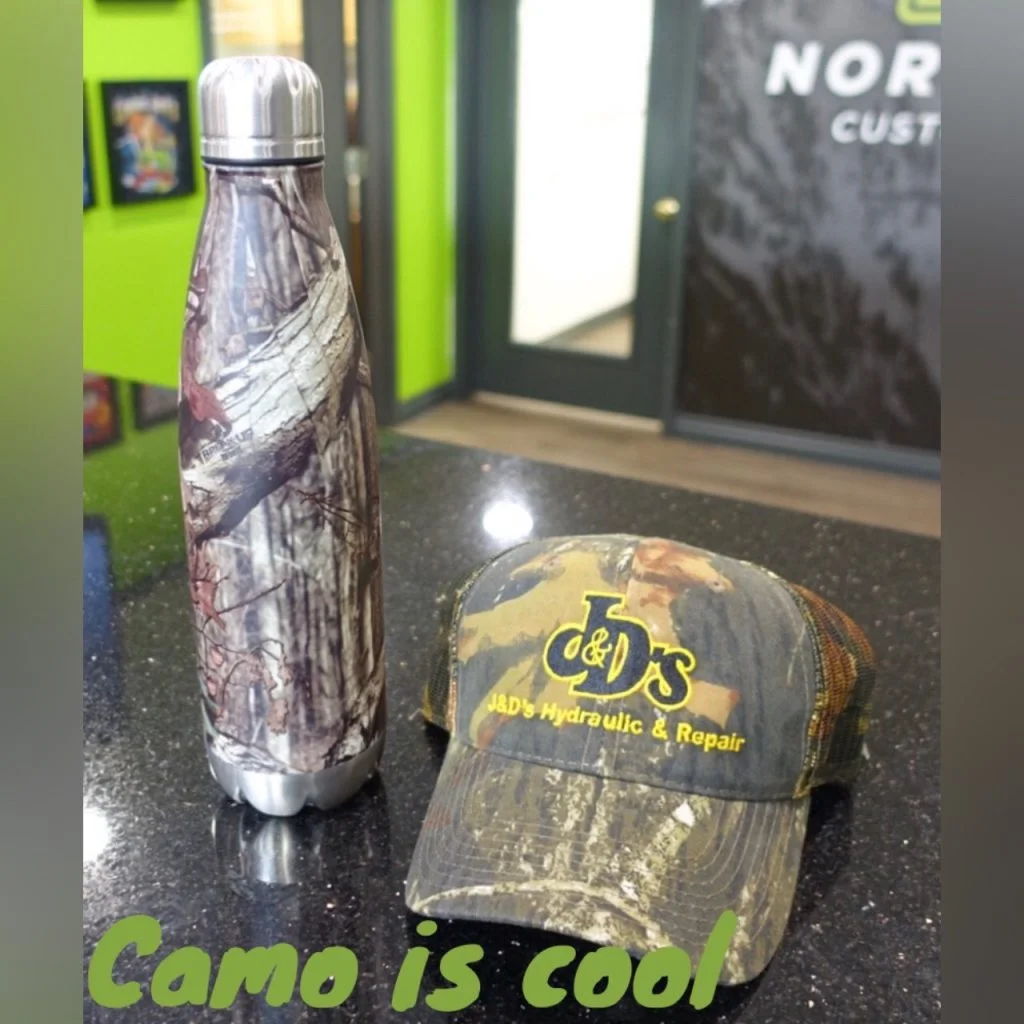Camouflaged Cap by Outdoor Cap. Water Bottle