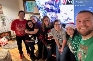 Group gathers round a Zoom meeting. We're on their Christmas gear